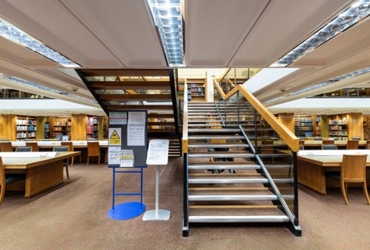 Interior photo of the stairs to the General Reading Room upper, mezzanine level at the National Library of Scotland.