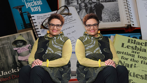 Photo of Jackie Kay over a background of material from her archive.
