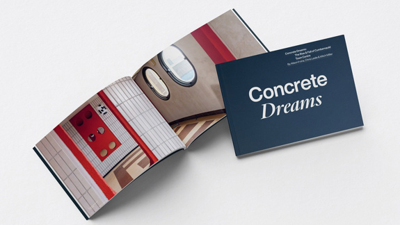 The cover of the 'Concrete Dreams' book and another copy of it open showing an interior of a building.