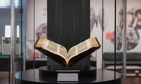 The Gutenberg Bible and on display in a case.