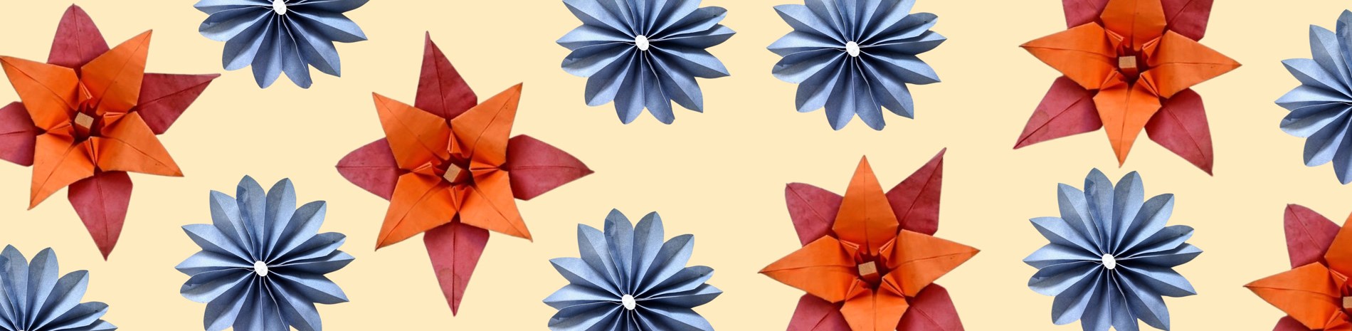 A colourful pattern of folded paper flowers.