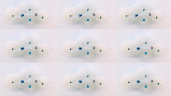 Cotton wool as a cloud with gems on it.