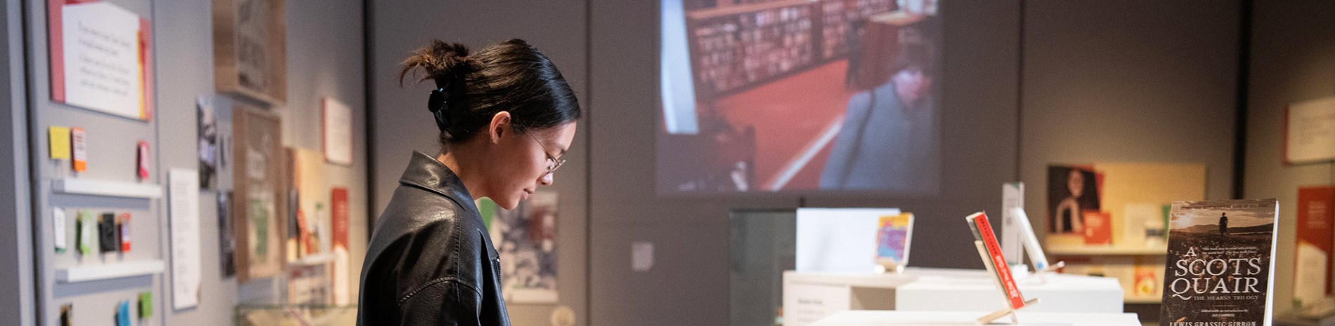 A person browsing books at an exhibition