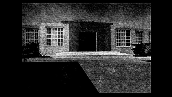 A grainy black and white still of a US Government building.