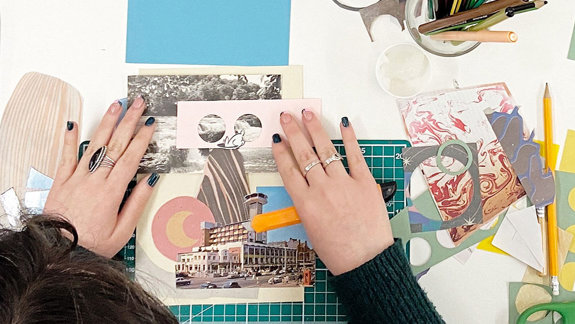 Someone arranging a collage.