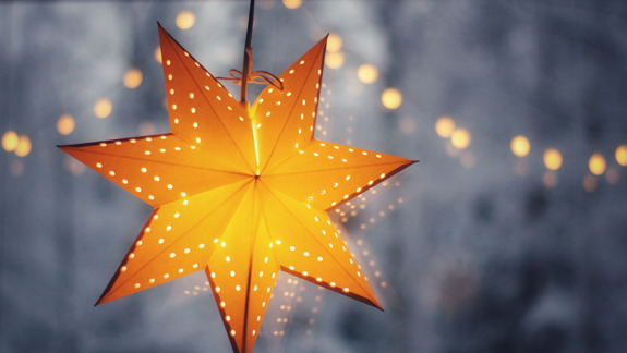 A star-shaped lantern strung up with fairy lights.