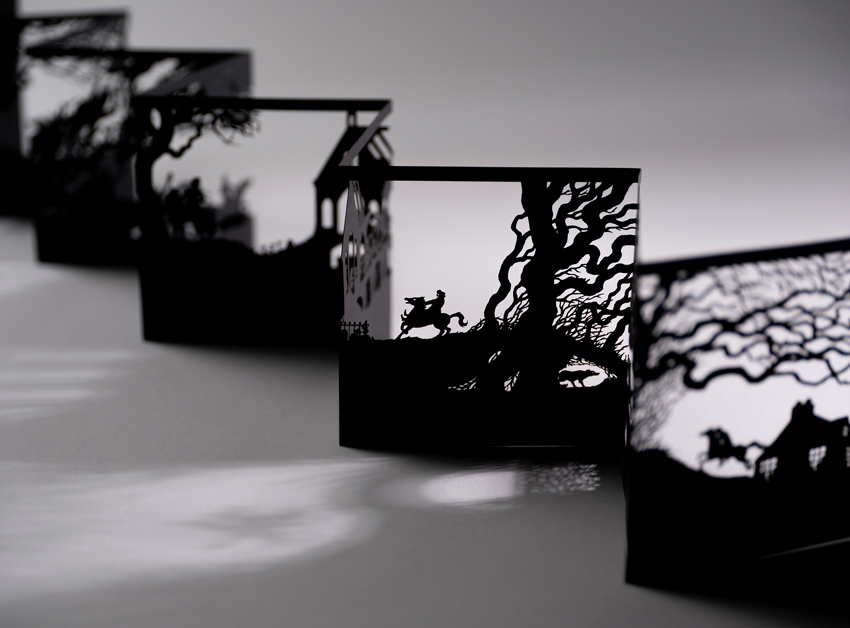 A black papercut concertina showing scenes from the story 'Tam O'Shanter' by Robert Burns.