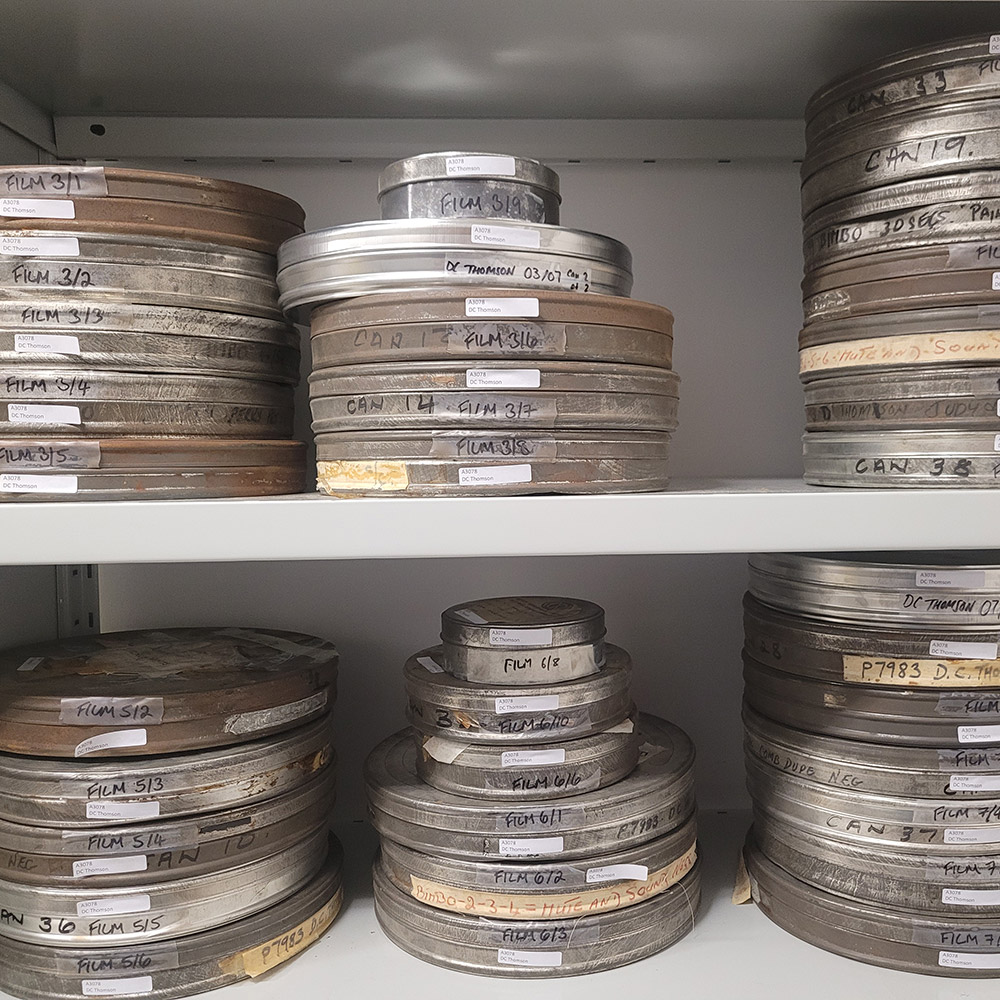 Photographs of three stacks of rustic looking film cans stacked on shelves.