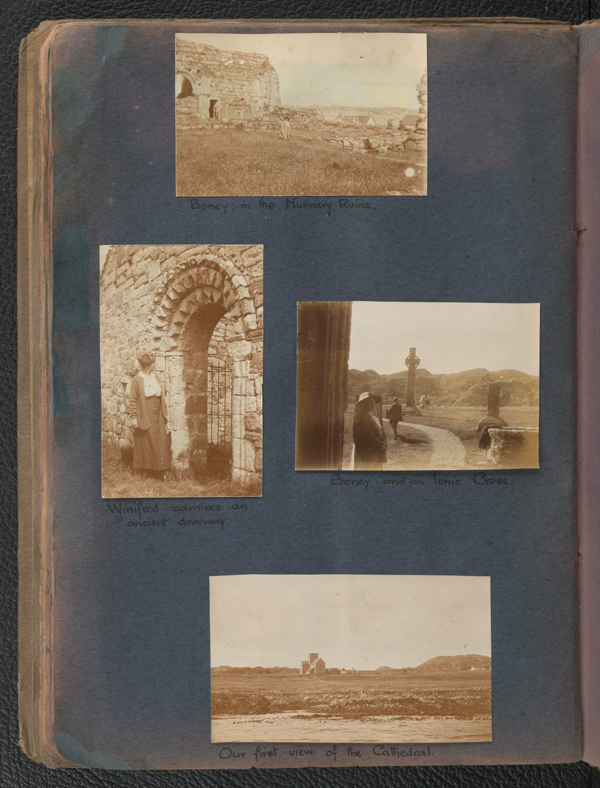 A page of an old photo album with four photos showing historic sites around Scotland.