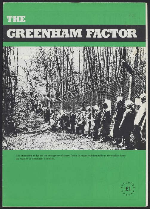 Booklet cover with a photo of a group of people standing in a line along a fence in a wooded area. Title reads 'THE GREENHAM FACTOR.'