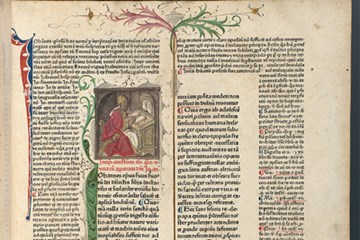 A page of an old book written in Latin. It has an illustration of a man in robes sitting at a desk with an open book on it.
