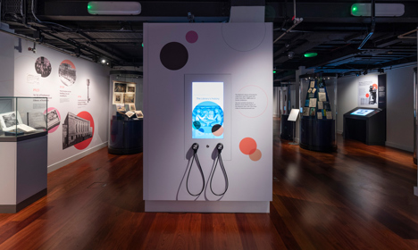 A long shot of the Treasures exhibition showing two listening devices telling about the Library's history.