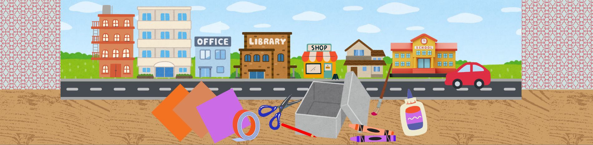 A selection of craft supplies on a table. In the background is a street with some buildings such as a library and a shop.