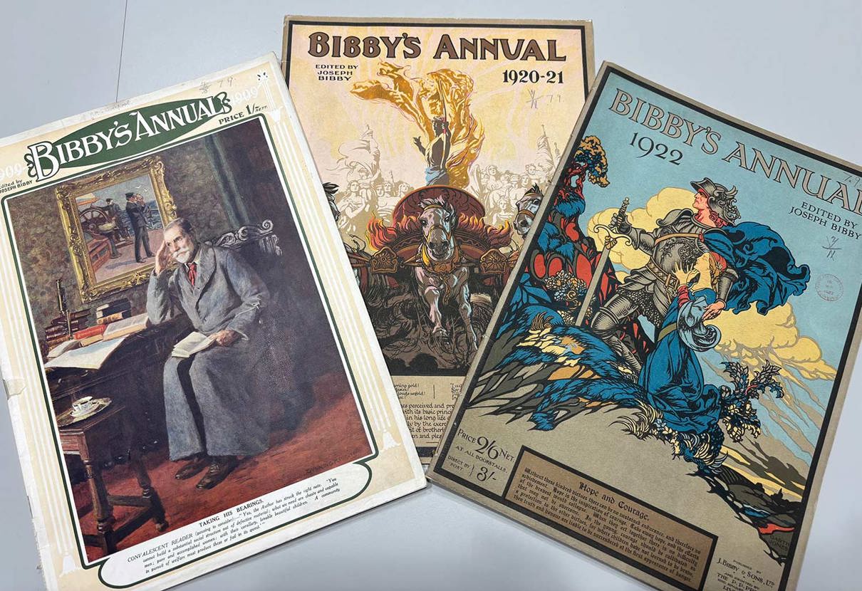 Three vintage Bibby's Annual magazine covers. One shows a man at a desk with books and papers, another features knights on horseback with a flaming sword, and the third depicts a knight in blue armor standing triumphantly.